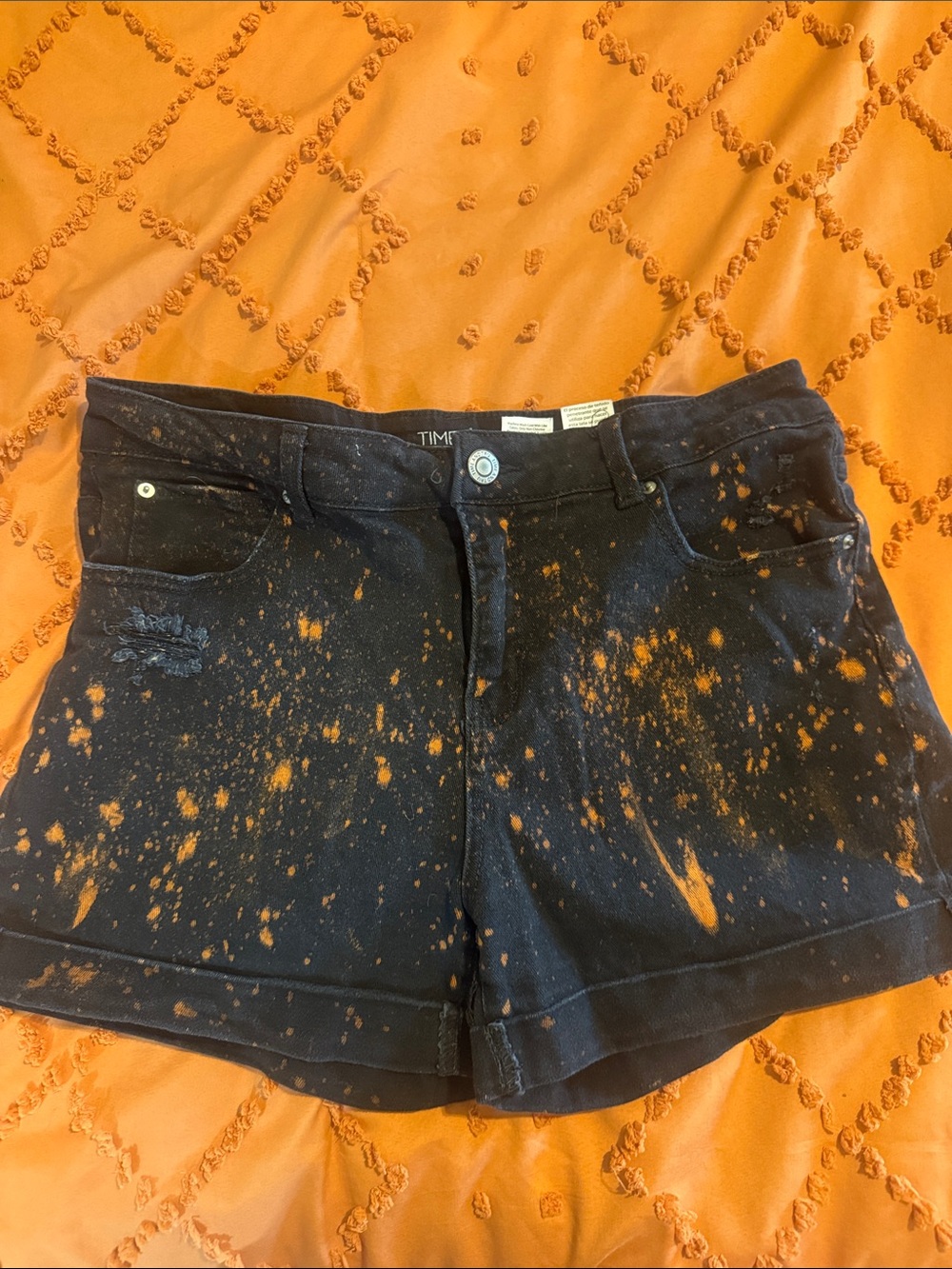 Time and Tru Black Mid- Rise Denim Shorts with Orange Bleach-Splatter